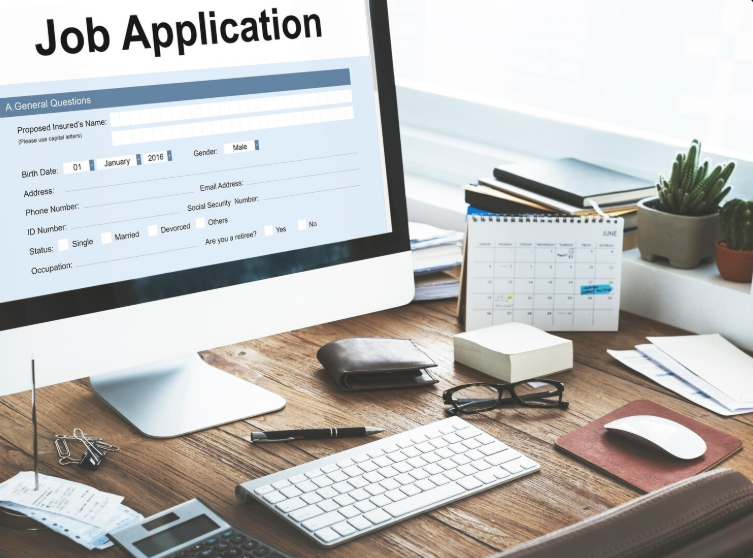 Professional job seeker working on a laptop while optimizing a resume and applying for jobs online, representing modern job search strategies, ATS resume optimization, networking, and career growth in 2026.
